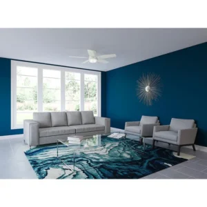 Interior Painting | Blue painting wall of living room with white sofas in it