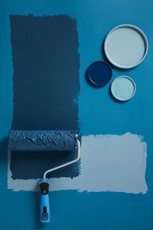 Painting Services Abu Dhabi | Blue roller brush painted on wall